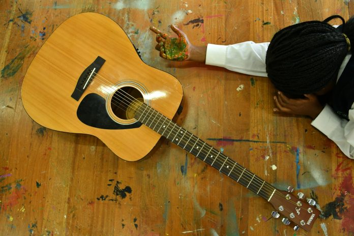 a person playing a guitar