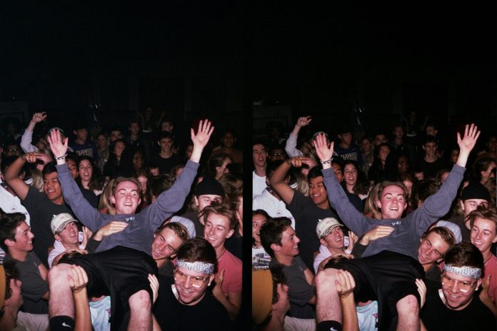 group of people raising their hands