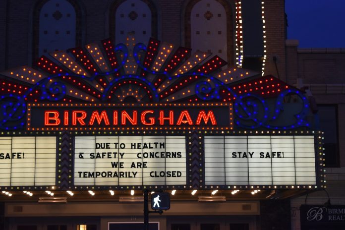 a large marquee sign with lights on it